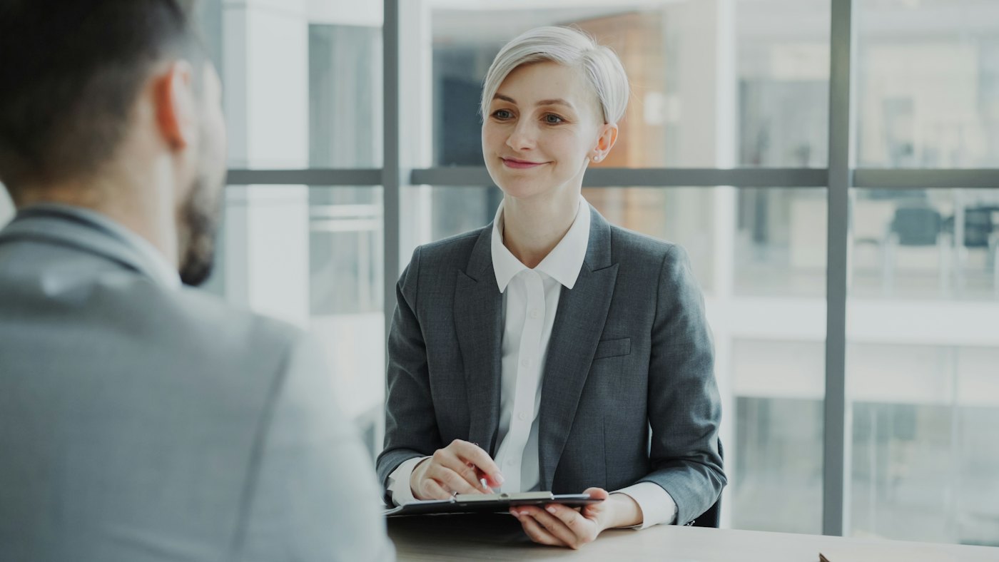 Attorney interviewing a client across a table