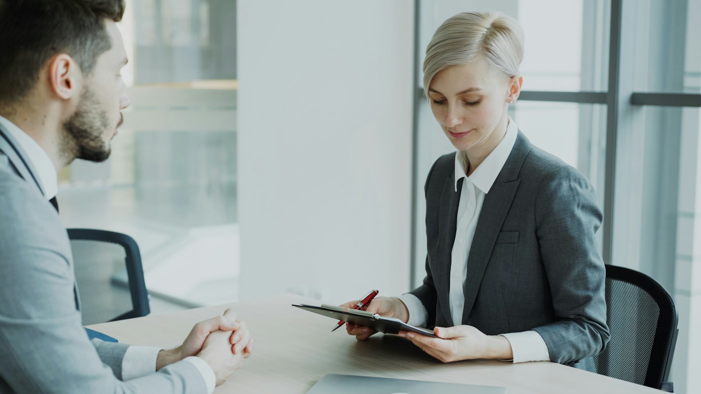 Attorney reviewing a document with a client