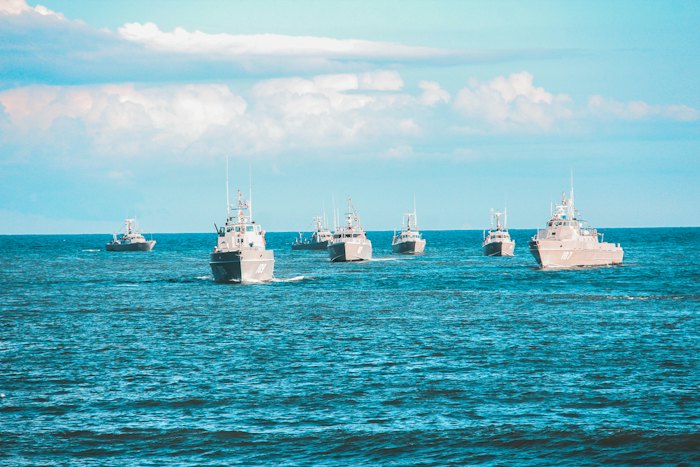 Navy ships sailing on the ocean
